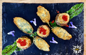 Pepite di halibut della Groenlandia con crostini di segale e salvia fritta