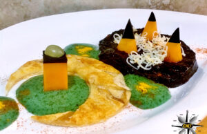 Mezzaluna di provola di Agerola con vellutata di riso Venere, mousse di basilico e colatura di alici