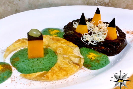 Mezzaluna di provola di Agerola con vellutata di riso Venere, mousse di basilico e colatura di alici