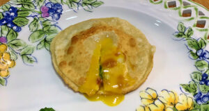 Raviolo medievale con uovo poché e crema di cime di rapa