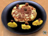 Porcino reale con fontina e culatello, pioppini e rösti alla curcuma