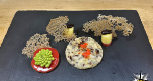 Fonduta di Beaufort con polvere di semi di cacao e corallo di baobab