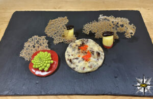 Fonduta di Beaufort con polvere di semi di cacao e corallo di baobab