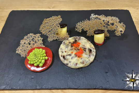 Fonduta di Beaufort con polvere di semi di cacao e corallo di baobab