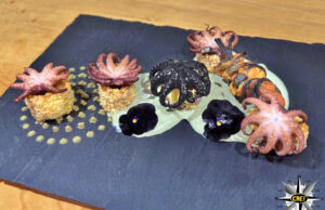 Soffioni di calamarata con polipetti marinati e cremoso di erba di grano