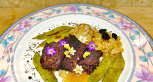 Medaglioni di sella di pecora in composta di pompia, con fregola e polvere di mirto