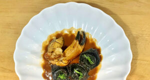 Tortelloni con polpa di granchio, bisque di gamberi e chela di granciporro
