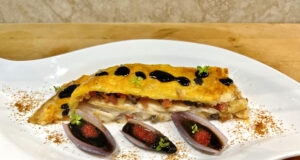 Ali di razza in crosta di pasta brisée, con brunoise di verdure, uova di capelin, bottarga di muggine e timo fresco